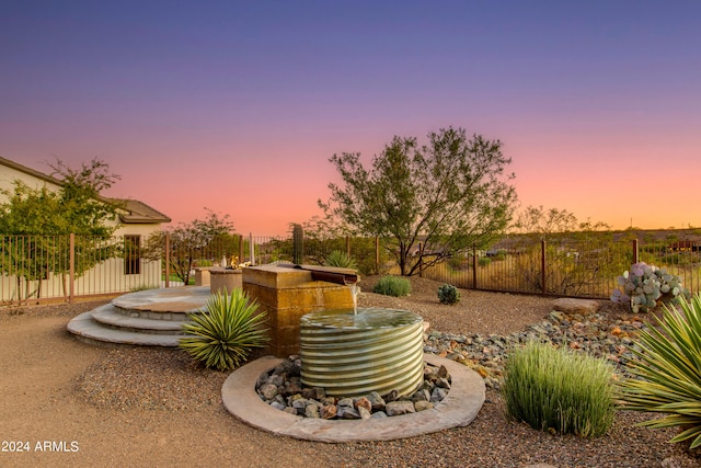 view of patio terrace at dusk