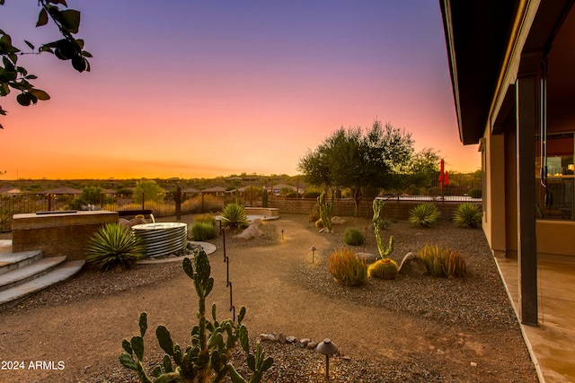 yard at dusk with a patio and cooling unit