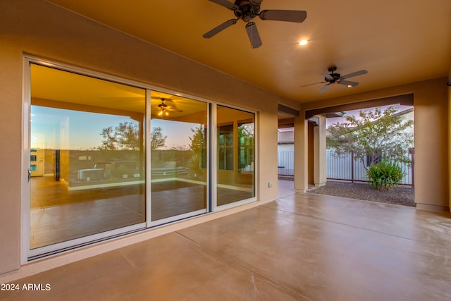 patio terrace at dusk with ceiling fan