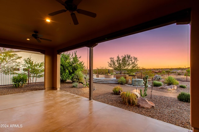 patio terrace at dusk with ceiling fan