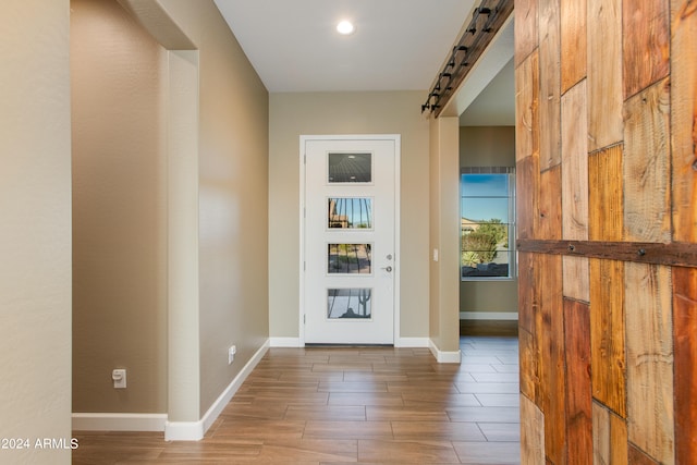 foyer entrance featuring hardwood / wood-style floors