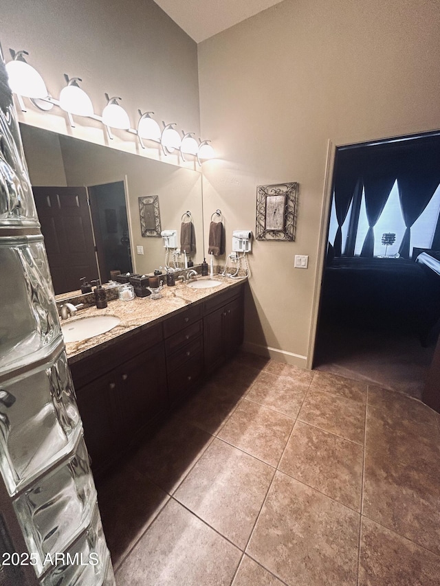 14000 N 94th St Unit 1077, Scottsdale, AZ 85260 - full bath featuring tile patterned flooring, double vanity, and baseboards