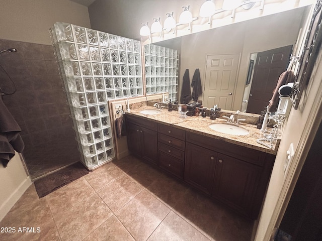 14000 N 94th St Unit 1077, Scottsdale, AZ 85260 - bathroom with double vanity, a walk in shower, and tile patterned flooring