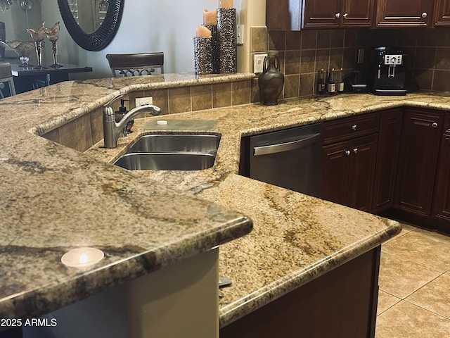 14000 N 94th St Unit 1077, Scottsdale, AZ 85260 - kitchen featuring stainless steel dishwasher, light stone countertops, decorative backsplash, light tile patterned floors, and a sink