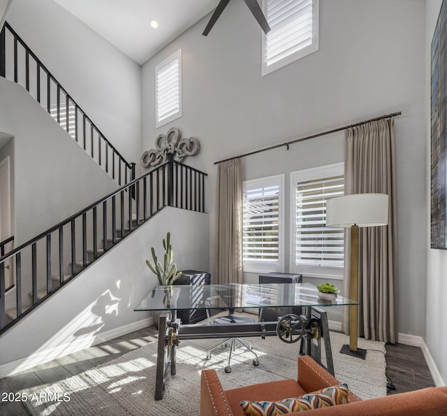 living room with plenty of natural light and a high ceiling