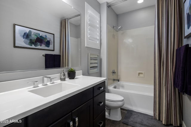 full bathroom featuring vanity, toilet, shower / tub combo, and wood-type flooring