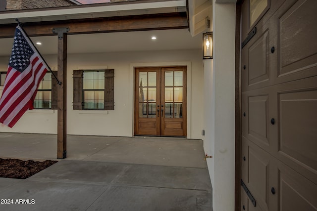 property entrance featuring french doors