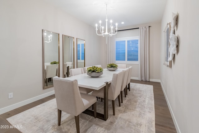 dining room featuring light hardwood / wood-style floors and an inviting chandelier