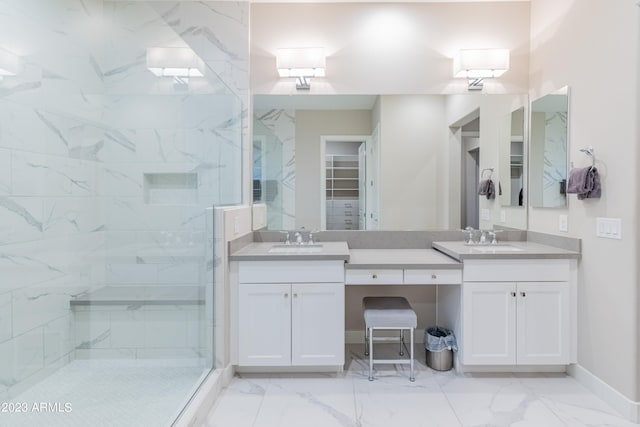 bathroom featuring vanity and an enclosed shower