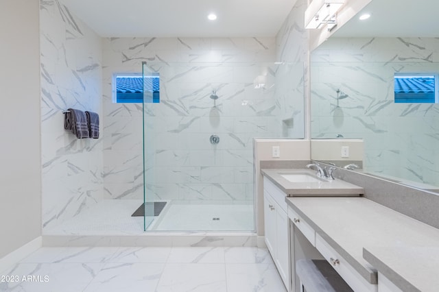 bathroom featuring vanity and tiled shower