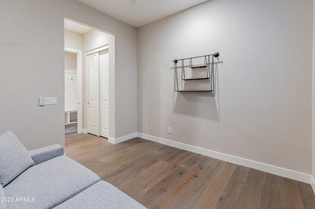 living area with hardwood / wood-style flooring