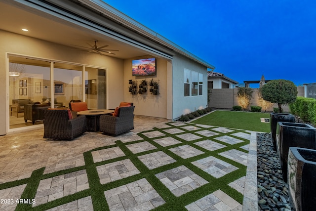 view of patio / terrace featuring ceiling fan