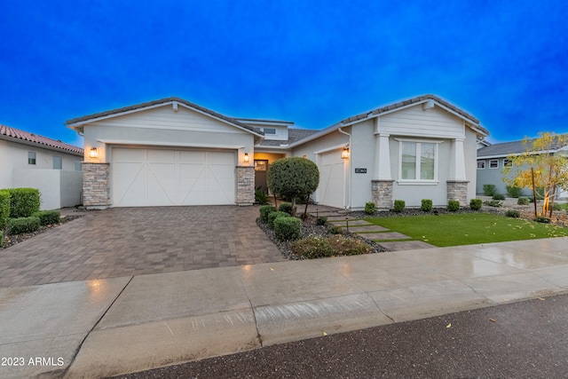 view of front facade featuring a garage and a front lawn