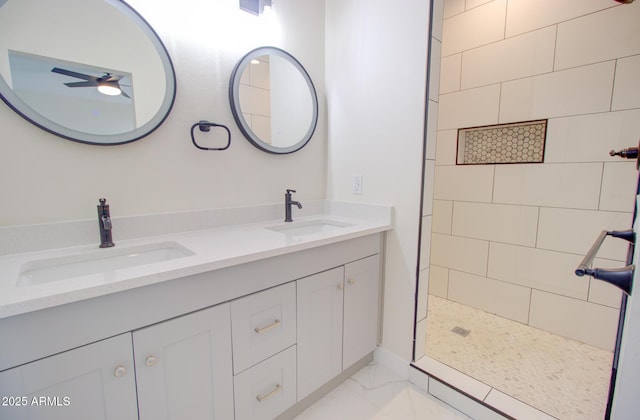 4115 N Monarch Dr, Eloy, AZ 85131 - full bathroom featuring marble look tiles, ceiling fan, tiled shower, and double vanity
