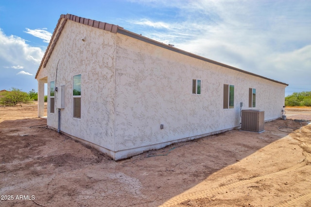 4115 N Monarch Dr, Eloy, AZ 85131 - view of side of home featuring central AC unit and stucco siding