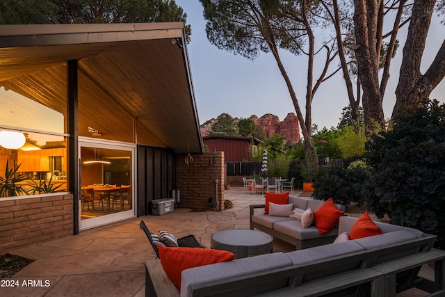 patio terrace at dusk with an outdoor living space