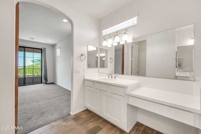 9017 E June Cir, Mesa, AZ 85207 - bathroom featuring vanity, wood finished floors, baseboards, and recessed lighting