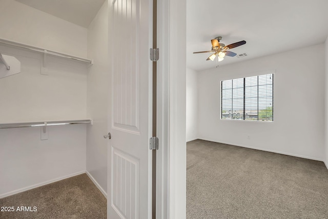 9017 E June Cir, Mesa, AZ 85207 - spacious closet featuring carpet flooring and a ceiling fan
