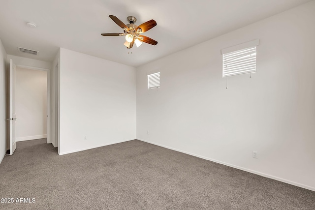 9017 E June Cir, Mesa, AZ 85207 - empty room featuring a ceiling fan, dark colored carpet, a smoke detector, and baseboards