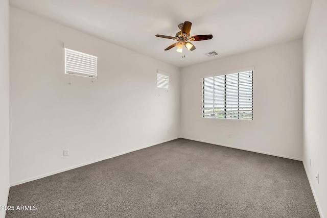 9017 E June Cir, Mesa, AZ 85207 - empty room with a ceiling fan, dark carpet, and baseboards
