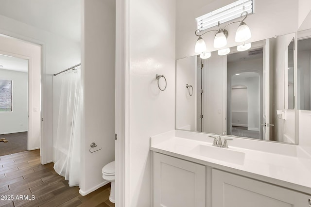 9017 E June Cir, Mesa, AZ 85207 - full bath with vanity, toilet, wood finished floors, and a shower with curtain