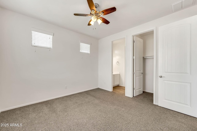 9017 E June Cir, Mesa, AZ 85207 - unfurnished bedroom featuring carpet floors, connected bathroom, baseboards, ceiling fan, and a closet