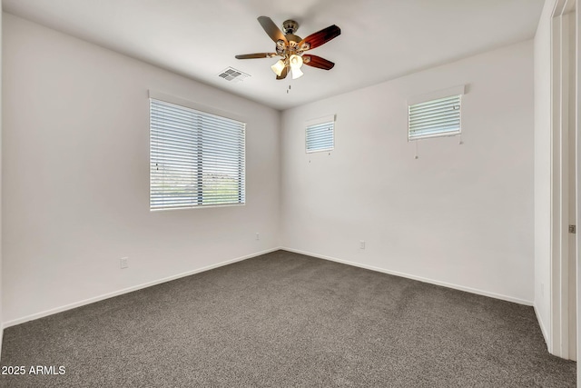 9017 E June Cir, Mesa, AZ 85207 - unfurnished room with dark colored carpet, ceiling fan, healthy amount of natural light, and baseboards