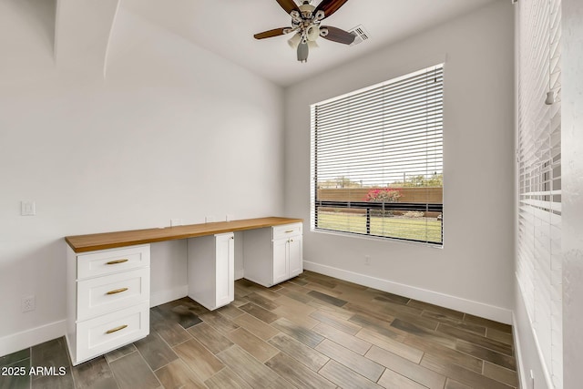 9017 E June Cir, Mesa, AZ 85207 - unfurnished office featuring a ceiling fan, baseboards, wood tiled floors, and built in study area