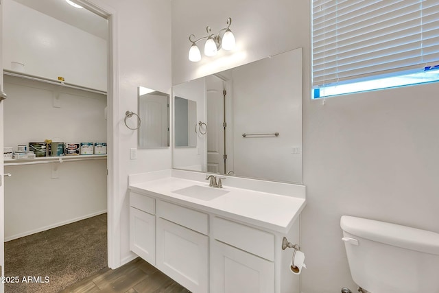 9017 E June Cir, Mesa, AZ 85207 - bathroom featuring vanity, toilet, and wood finished floors