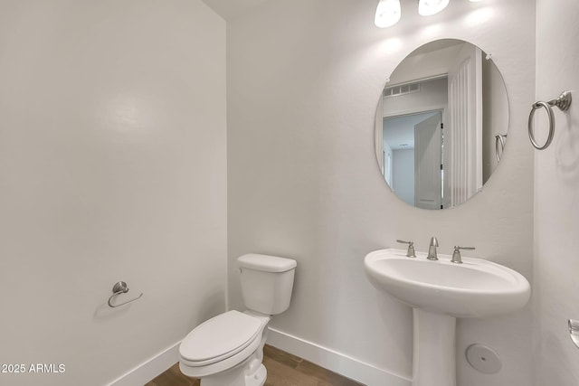 9017 E June Cir, Mesa, AZ 85207 - bathroom with toilet, baseboards, wood finished floors, and a sink