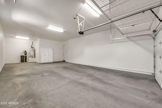 9017 E June Cir, Mesa, AZ 85207 - garage featuring water heater, baseboards, and a garage door opener