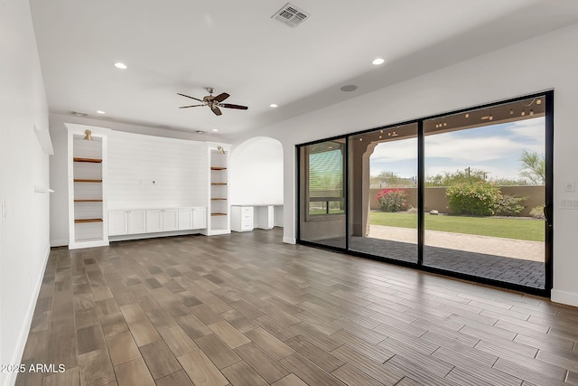 9017 E June Cir, Mesa, AZ 85207 - unfurnished living room with recessed lighting, dark wood-style floors, a ceiling fan, and arched walkways