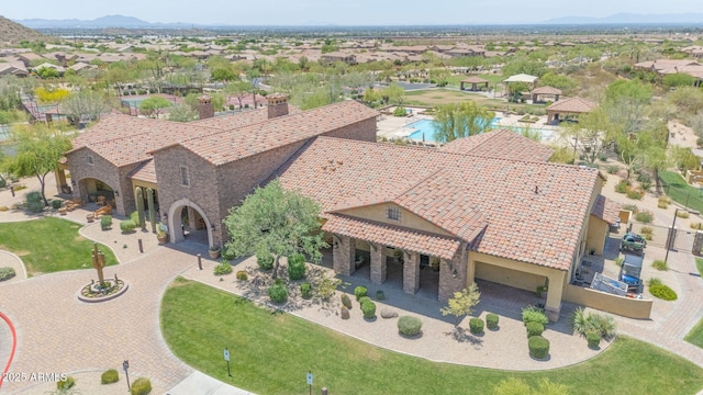 9017 E June Cir, Mesa, AZ 85207 - view of front of property featuring stucco siding, a mountain view, a chimney, and stone siding
