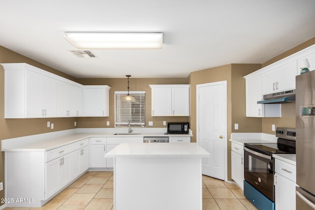 kitchen with a kitchen island, a sink, under cabinet range hood, appliances with stainless steel finishes, and white cabinetry