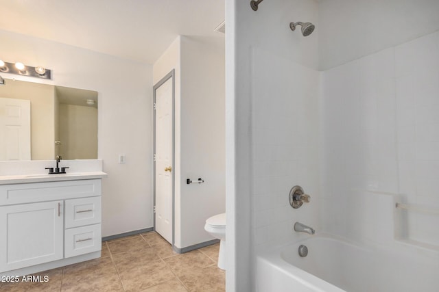 bathroom featuring vanity, bathing tub / shower combination, toilet, and tile patterned floors