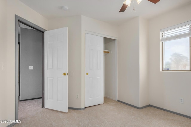 unfurnished bedroom featuring carpet flooring, ceiling fan, and baseboards