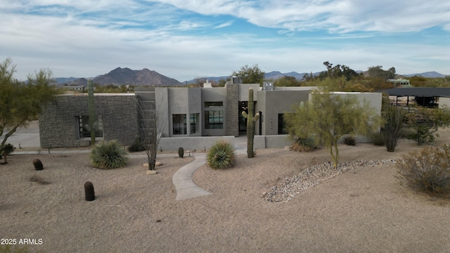 rear view of house with a mountain view