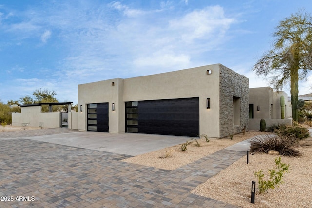 pueblo-style house featuring a garage