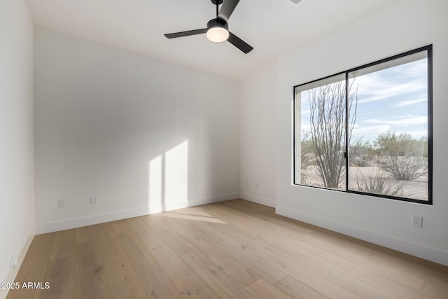 unfurnished room with ceiling fan and light hardwood / wood-style floors