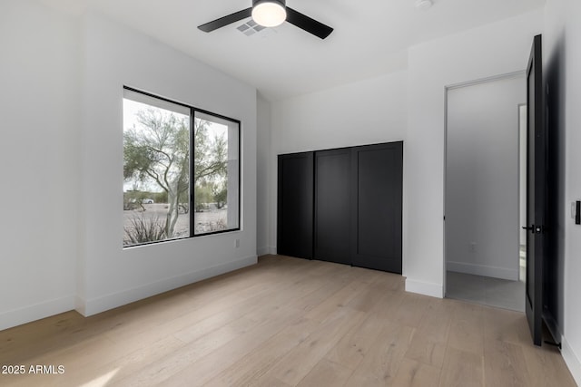 unfurnished bedroom featuring ceiling fan and light hardwood / wood-style flooring