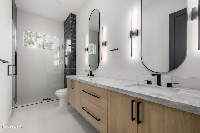 bathroom featuring vanity, an enclosed shower, tile patterned floors, and toilet