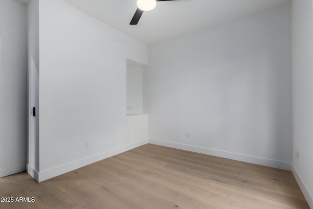 unfurnished room featuring light hardwood / wood-style flooring and ceiling fan