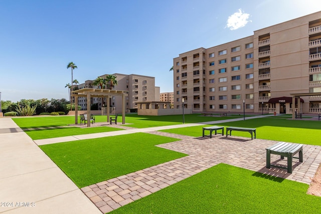 view of community featuring a yard