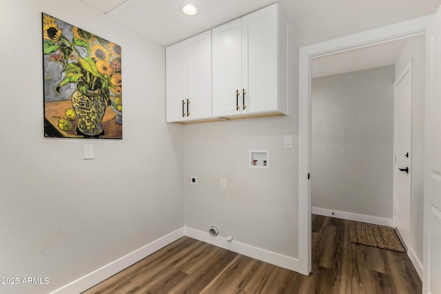 clothes washing area featuring hookup for a washing machine, electric dryer hookup, dark wood-type flooring, baseboards, and cabinet space