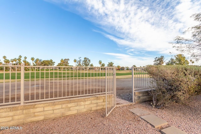 view of gate with fence