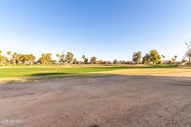 view of property's community with a lawn