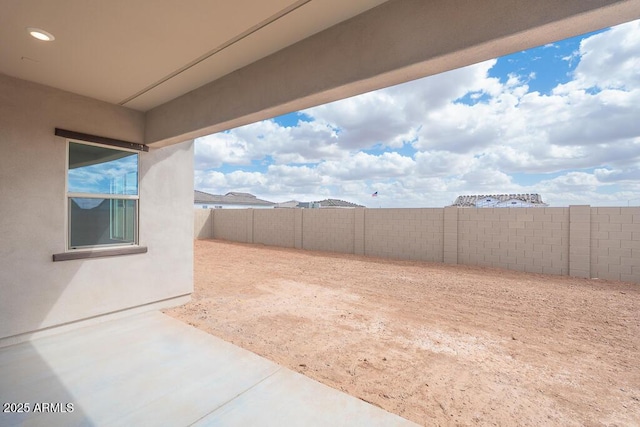 view of yard with a patio area and a fenced backyard