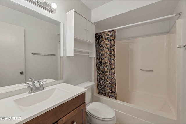 bathroom with shower / tub combo, vanity, and toilet