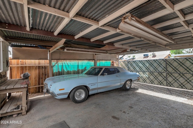 view of parking with fence