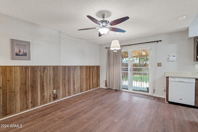 interior space featuring a textured ceiling, wood finished floors, and a ceiling fan